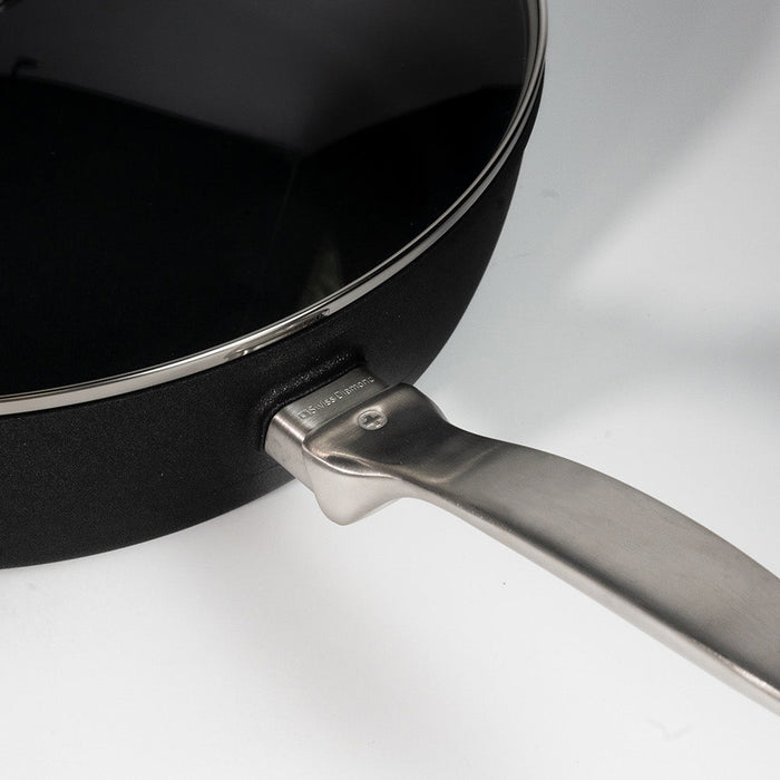 Black pan with a stainless steel handle