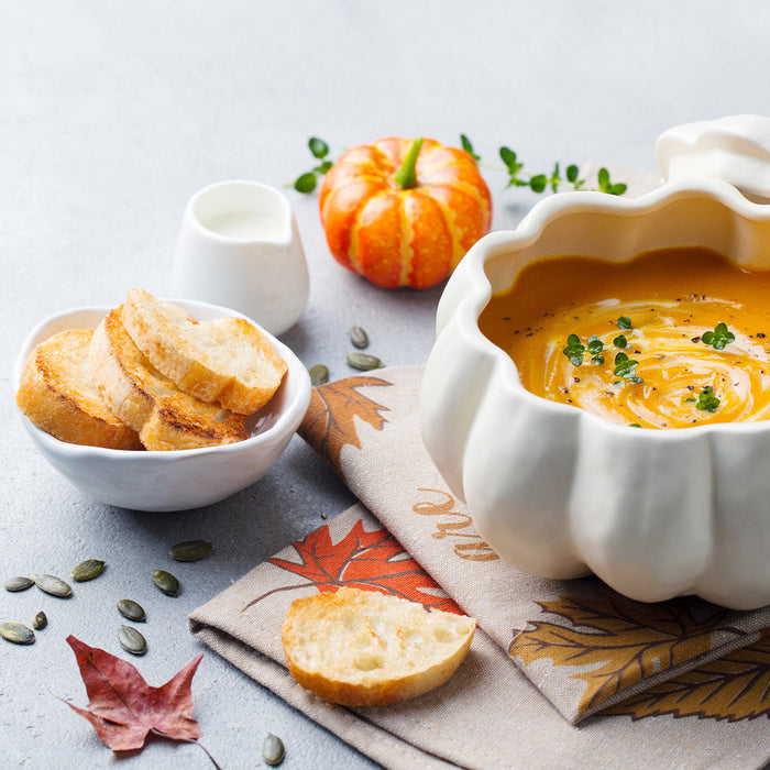 Sweet potato chili in a bowl surrounded by fall decorations
